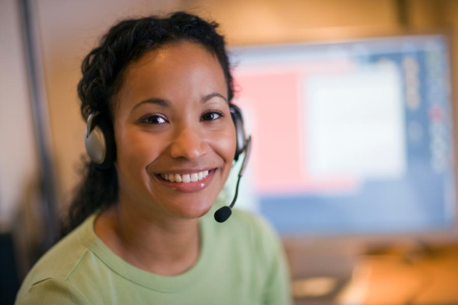 A smiling female customer service representative