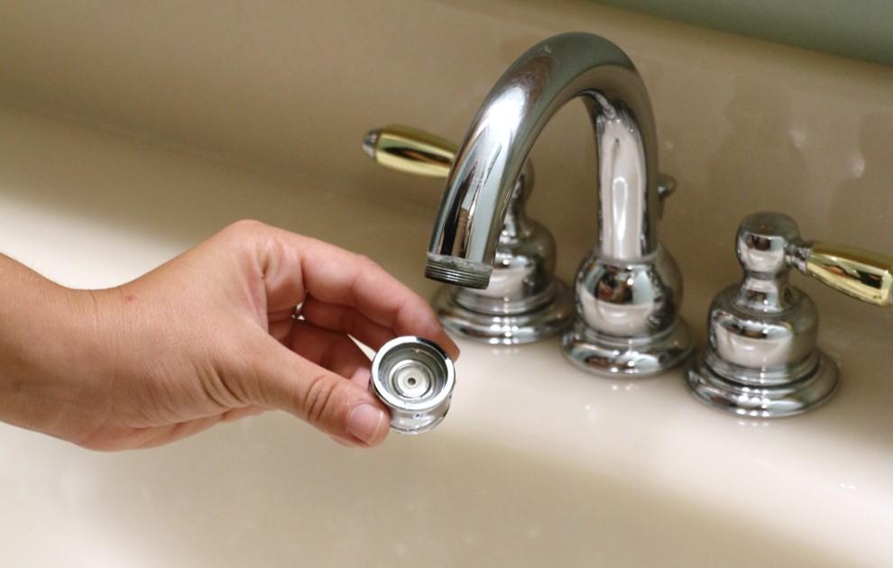 Close up of a faucet aerator