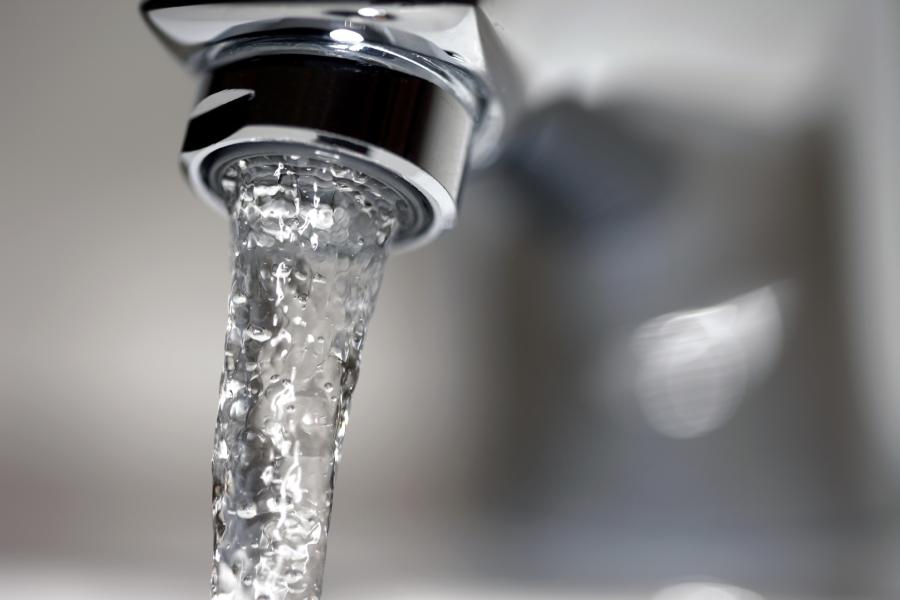 Close up of water coming out of a faucet