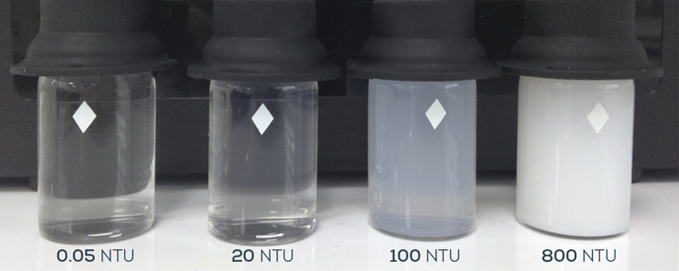 Four test tubes showing various levels of turbidity